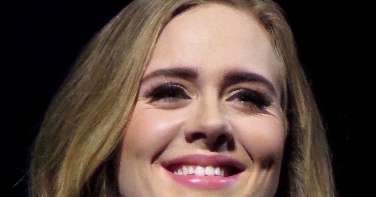 Adele net worth, smiling portrait from 2016
